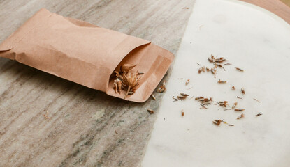 Wild flower seeds collected in a brown packet