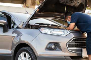 car service, repair, maintenance and people concept - man repiar auto mechanic outdoor.