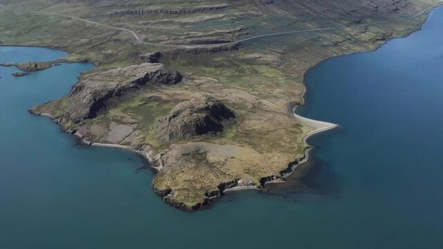 Holmanes peninsula with blue water of Rey&eth;arfj&ouml;r&eth;ur fjord in Iceland, aerial