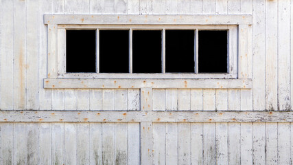 Obraz na płótnie Canvas Background of old wood barn wall with windows