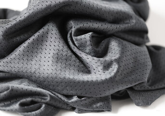 grey-blue synthetic material mesh with folds on white