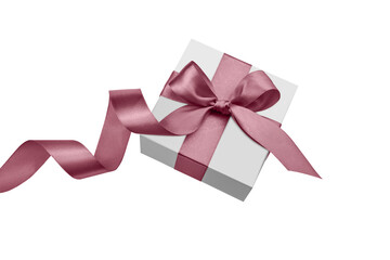 White gift box with pink bow and satin ribbon isolated on white background.	