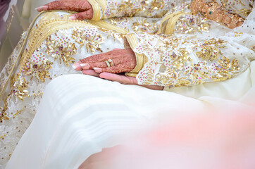 A moroccan wedding couple hands...