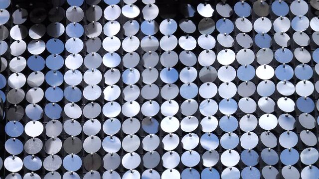 Abstract decoration from round shiny metallic spangles, silver color