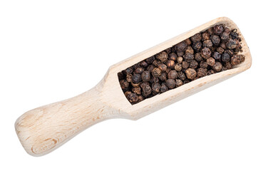 black pepper peppercorns in wood scoop cutout