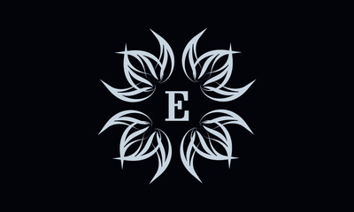 Obraz premium Vintage exquisite floral monogram with the letter E as a sign of business, boutique, shop, cafe, hotel, etc. Gray sign on a dark background