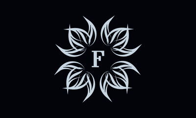 Vintage exquisite floral monogram with the letter F as a sign of business, boutique, shop, cafe, hotel, etc. Gray sign on a dark background