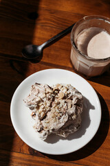 Airy protein chocolate cake with nuts and drunk cocoa in glass. Relaxation and Slowdown Time.