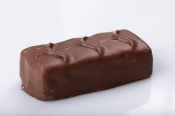 Milk chocolate bar on a white background