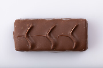 Milk chocolate bar on a white background