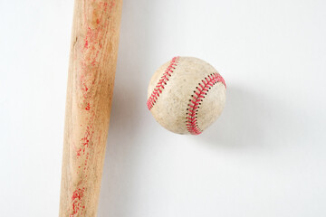 Wooden baseball bat and ball isolated on white background for sport.