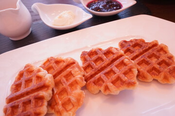 Waffle on white plate with blueberry jam and whip cream - 白い皿にのったワッフル ブルーベリージャム ホイップクリーム
