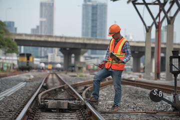 Fototapeta premium engineer, worker standing on railway inspection. construction worker on railways. Engineer work on railway. rail, engineer, Infrastructure,