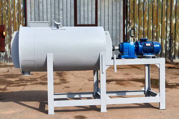 freshly painted new concrete mixer with installed electric motor 