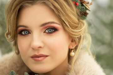 beautiful girl with flowers in her hair in winter, bride, portrait