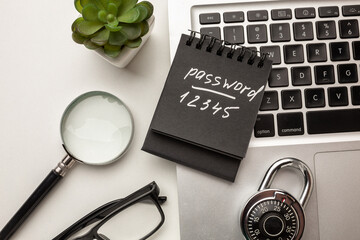 Strong steel coded lock on a laptop keyboard. IT security policies, passwords codes management, account and network security. Top view