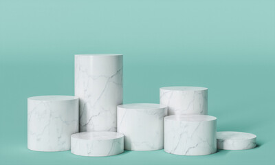 cylindrical podium in white marble on a turquoise background.