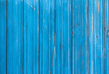 wooden background, old wooden wall, painted blue, with slits and nails.
