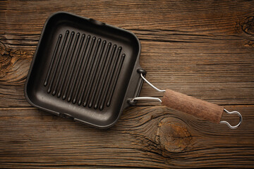 Black pan grill. Top view with space for an inscription