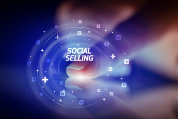 Finger touching tablet with social media icons concept