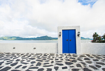 Iconic blue door in the bank of Tondano Lake, a beautiful tourist destination in Minahasa, North Sulawesi, Indonesia.
