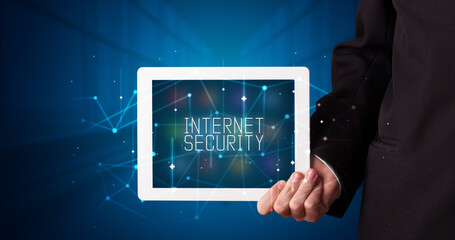 Person holding tablet, security concept