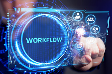 Business, Technology, Internet and network concept. Young businessman working on a virtual screen of the future and sees the inscription: Workflow