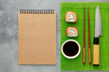 Sushi set sashimi and sushi rolls served on stone slate