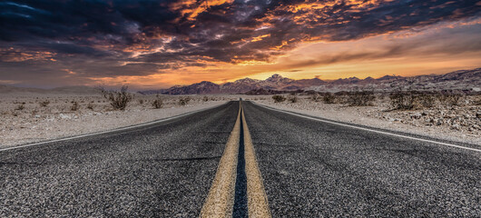Route 66 in the desert with scenic sky. Classic vintage image with nobody in the frame.