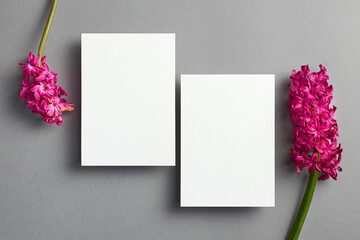 Invitation card mockup, front and back sides with spring hyacinth flowers on grey