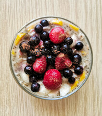 Healthy breakfast for brain. Porridge (oatmeal) with chia seeds and blueberries, sprinkled with cinnamon