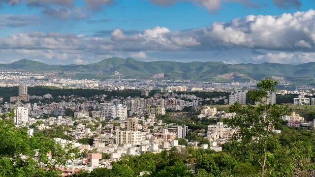 Cityscape View and Time Lapse of Clouds Passing over and Casting Shadows over the City of Pune, Maharashtra, India