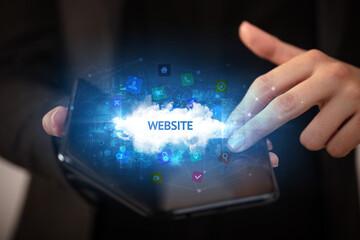 Businessman holding a foldable smartphone, technology concept