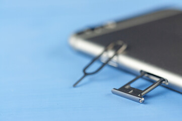 smartphone with a SIM card key, SIM card, SIM card space is open in