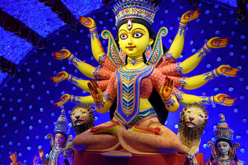 Idol of Goddess Devi Durga at a decorated puja pandal in Kolkata, West Bengal, India. Durga Puja is...