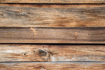 Wooden background. Old boards laid flat. The structure of a dried brown wood.