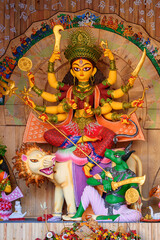 Idol of Goddess Devi Durga at a decorated puja pandal in Kolkata, West Bengal, India. Durga Puja is...