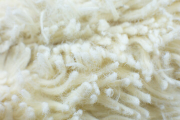 White cotton towel or carpet.fluffy texture background. Close up, macro photo. Soft focus image.