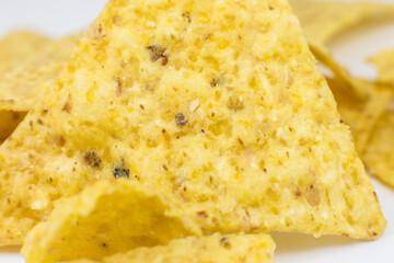 Close up, Triangular chips, mexican nachos, on white background. Perfect Tasty spicy snack for a beer.