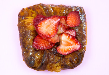Puff pastry bun or roll. Cake with fresh strawberries. Delicious sweets temptation and desserts on...