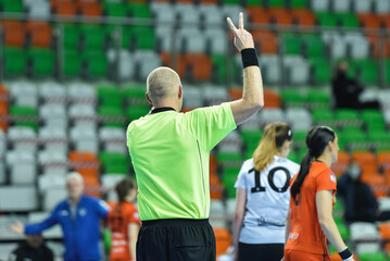Referee shows two minutes of punishment during women handball match - obrazy, fototapety, plakaty