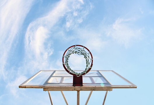 Empty basketball hoop basket over blue sky