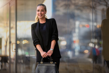 Candid portrait of a pretty and beautiful young business woman in a stylish and fashionable suit...