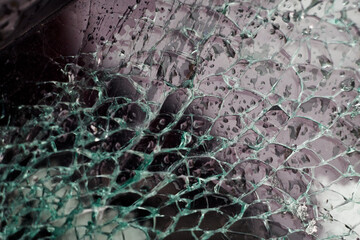 A broken window of a car crashed in a car accident