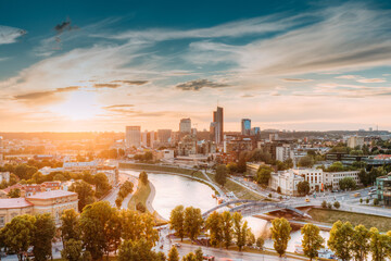 Vilnius, Lithuania. Sunset Sunrise Dawn Over Cityscape In Evening Summer. Beautiful View Of Modern Office Buildings Skyscrapers In Business District New City Centre Shnipishkes