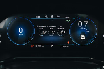 Modern light car black and blue mileage. Car dashboard with sensors and information. RPM, Fuel indicator and temperature.