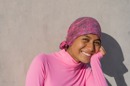 Young Woman With Cancer Showing Hope In Her Smile. Hope, Struggle, Empowerment Concept.