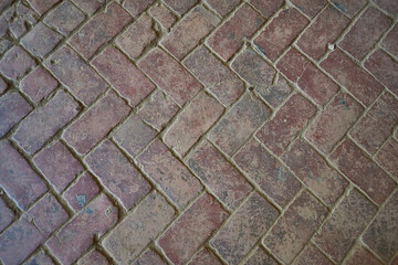 Texture and background of old brown brick paving slabs. Top view