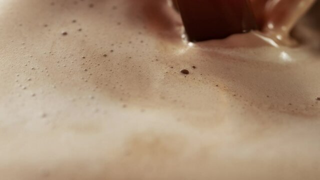 Super slow motion of pouring coffee in detail. Filmed on high speed cinema camera, 1000fps.