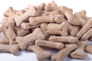 Studio lighting. dog food in the shape of a bone. On a white background.